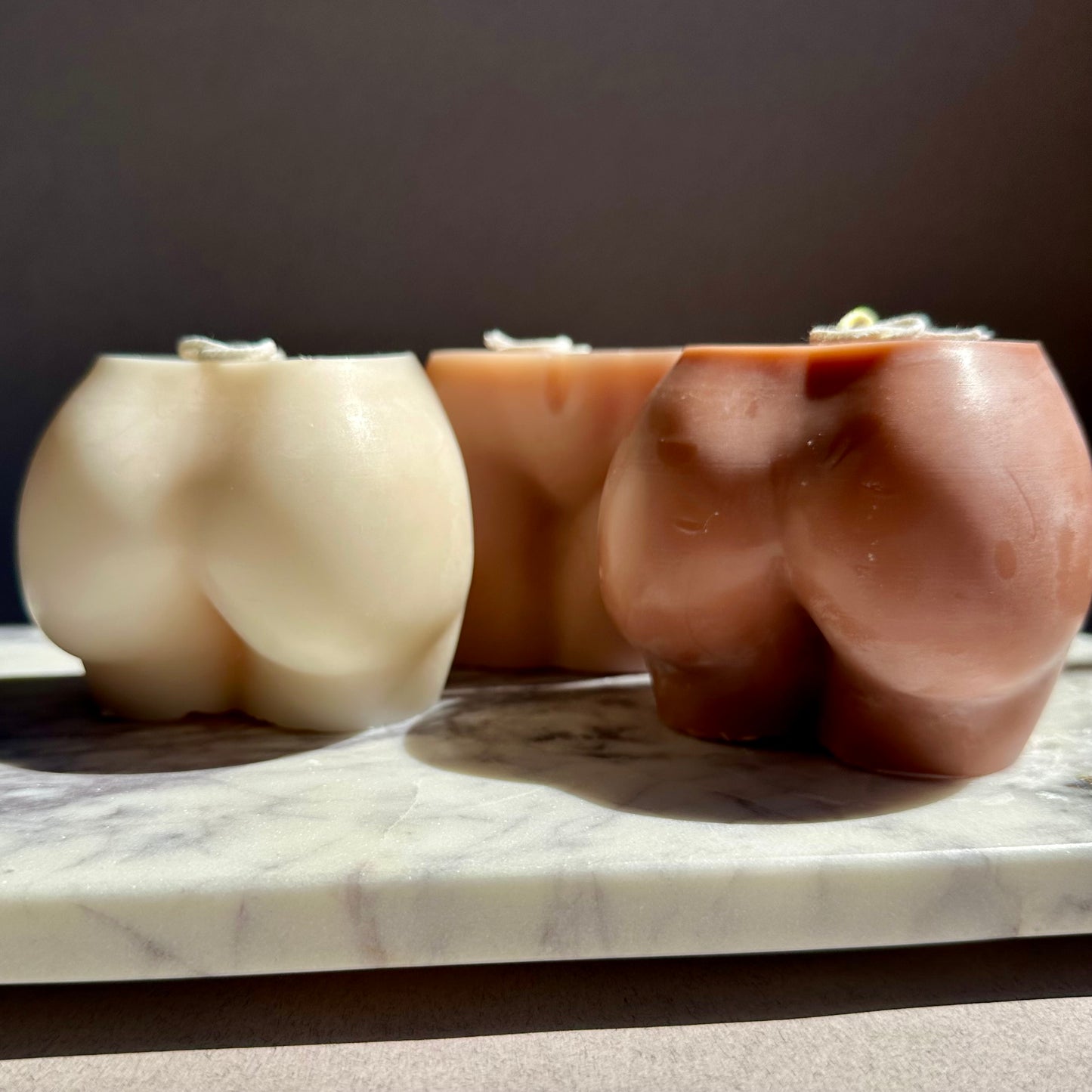 bum shaped candle nude tones
