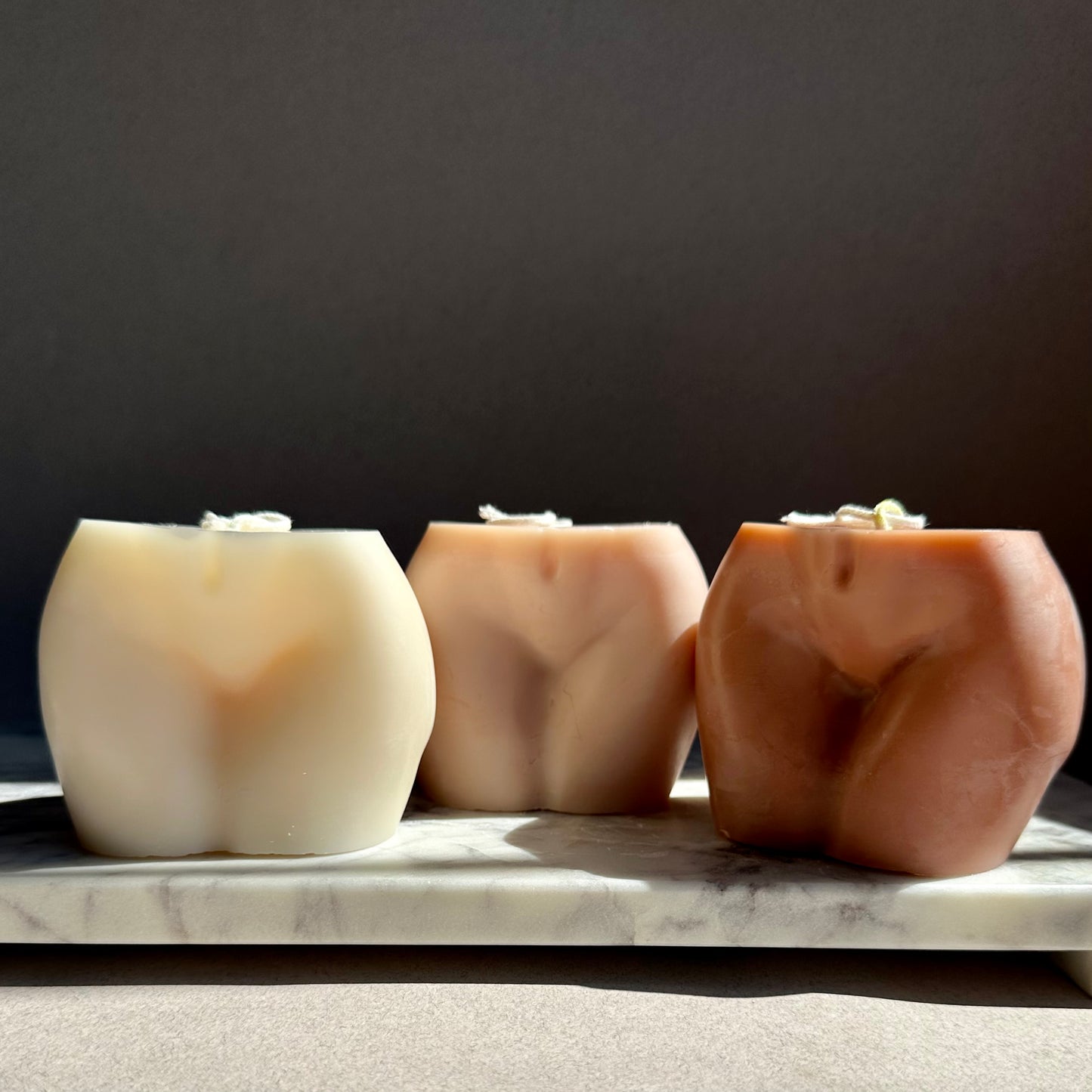bum shaped candle nude tones