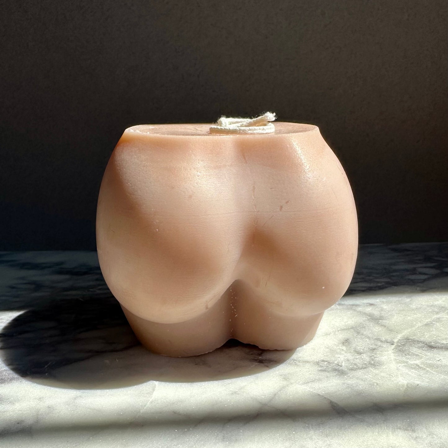 nude bum shaped candle nude tones
