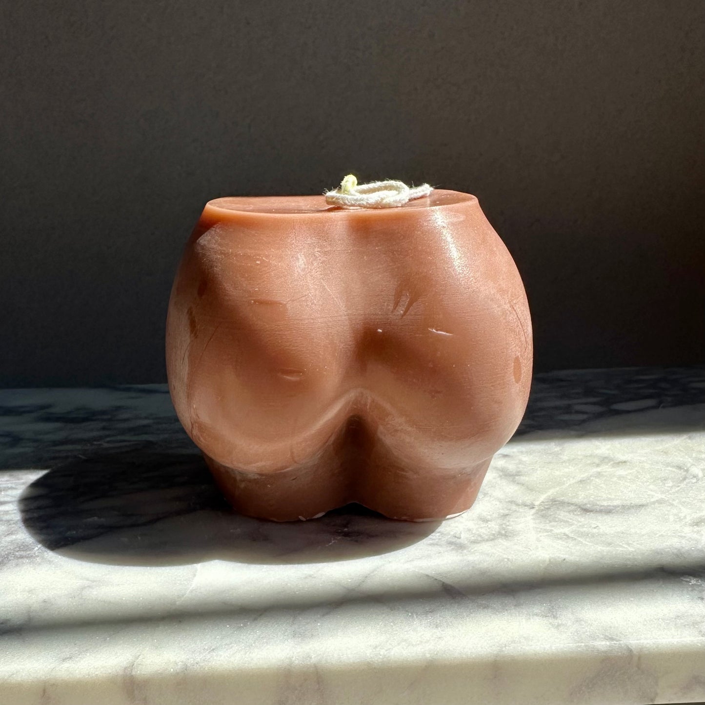 brown bum shaped candle
